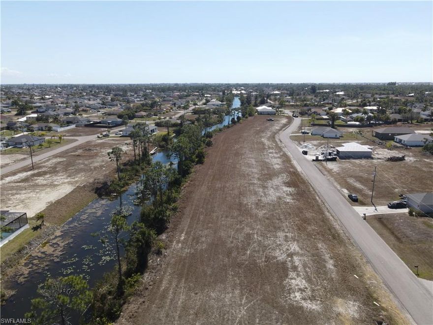 This area is growing! Invest in the land or build your own piece of paradise on this waterfront lot in Northwest Cape Coral. 80x125' lot, Eastern rear-exposure, 81 ft. wide freshwater canal, lot is NOT in a flood zone. Cape Coral has a lot to offer, with more in the pipeline! Boating, golfing, a water park, several nature parks, sports parks, a variety of restaurants, and nearby beaches offer something for everyone. New home construction options offered by Valco Construction, or you can work with the company of your choosing post-sale.