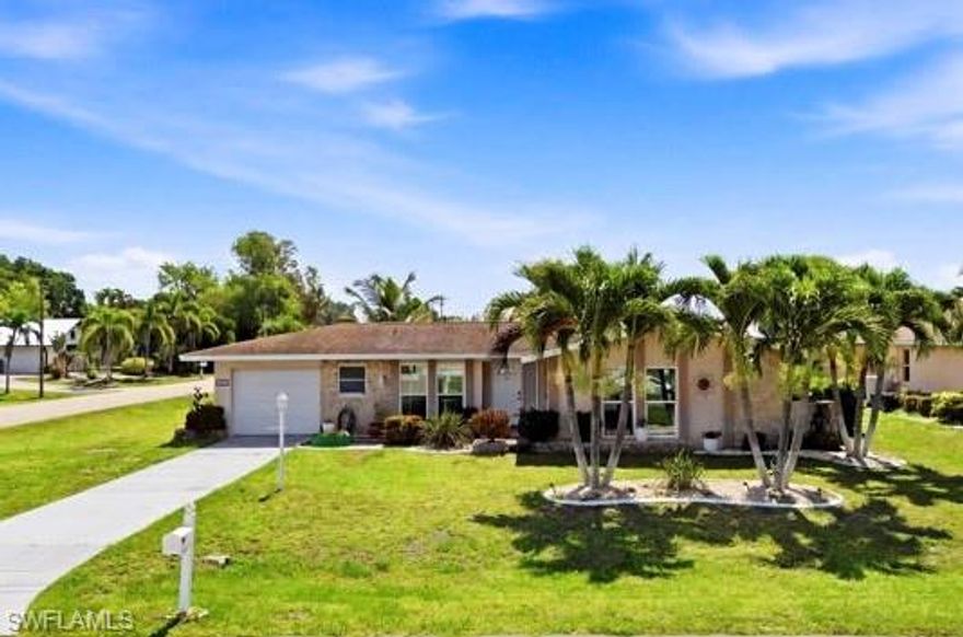 This charming 2-bedroom, 2-bath pool home offers the perfect blend of comfort, convenience, and laid-back Florida living. The house is situated on an OVERSIZED corner lot in a desirable SE Cape Coral neighborhood. This home features a bright and functional floor plan with over 1,100 square feet of living space designed for easy everyday living. Step outside and enjoy your private screened-in HEATED SALTWATER pool and spacious lanai. It has the perfect setting for relaxing afternoons, entertaining guests, or soaking up the sunshine year-round. Beautiful hibiscus plants line the exterior of the pool cage, creating a colorful tropical backdrop and added privacy. There’s also a FENCED side yard area that’s perfect for dogs, gardening, or extra outdoor space.
Inside, you’ll find tile flooring, comfortable living spaces, and a welcoming atmosphere ideal for full-time residents, seasonal owners, or an investment opportunity. The home also features an AC replaced in 2018 and hurricane-impact windows, providing both energy efficiency and peace of mind during Florida storm season.
With no HOA restrictions and close proximity to shopping, dining, and downtown Cape  Coral.  This home offers both convenience and lifestyle. Whether you’re looking for a winter retreat, starter home, or income-producing property, this one checks all the boxes.
Florida living starts here!