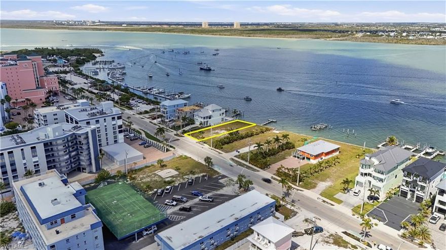 Premier Coastal Luxury Bayfront Homesite | Beach-to-Bay Lifestyle. An extraordinary opportunity to build a custom Bayfront luxury estate on this exceptional homesite overlooking Estero Bay, ideally positioned on the highly coveted north end of Fort Myers Beach. This rare property offers 8,525 sq ft +/- , 50 ft x 160 ft and the potential to design an elevated residence capturing sweeping panoramic bay views with the Beaches just across the street, creating the ultimate beach-to-bay lifestyle. Perfectly situated for boating enthusiasts, the property offers direct access to Estero Bay, the Gulf and world-class destinations such as Sanibel Island, Boca Grande, Cabbage Key, and numerous waterfront restaurants nearby on Fort Myers Beach  just a scenic boat ride away. Envision a stunning custom home designed to maximize the waterfront setting, with expansive terraces and outdoor living spaces perfect for enjoying vibrant sunrises over the bay and breathtaking sunsets over the Gulf. The homesite provides ample room for a resort-style pool, outdoor entertaining areas, and a private dock for effortless days on the water. 

Located just a short stroll along the beach to Times Square, the Pier District, Margaritaville, and a vibrant collection of restaurants, boutiques, and island entertainment, this property blends luxury waterfront living with walkable coastal charm.

A rare and coveted opportunity to create a signature waterfront estate in one of Fort Myers Beach’s most prestigious and desirable locations.
An ASSEMBLAGE opportunity is available with the adjacent lot at 385 ESTERO. Multiple Builder Introductions available.