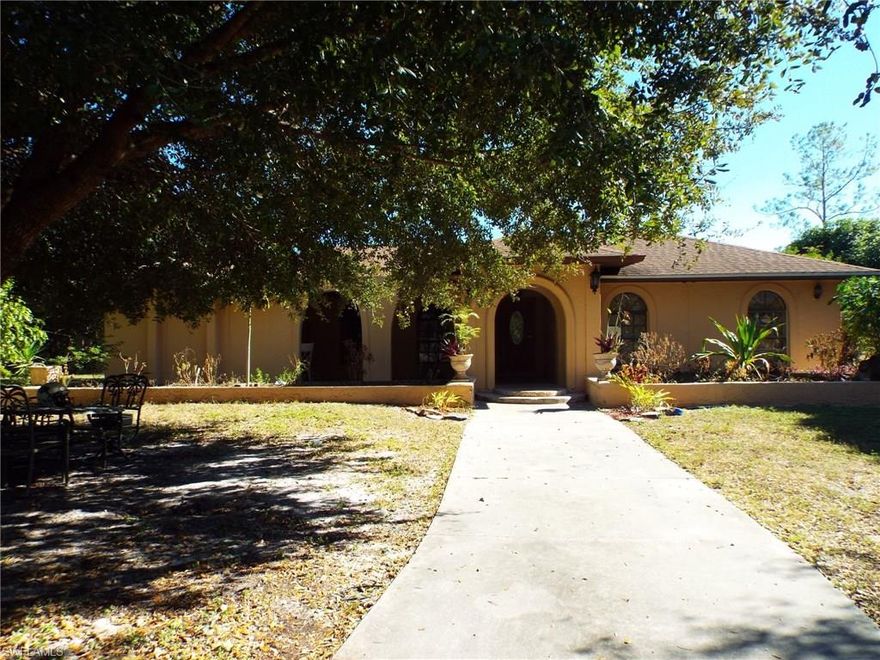 Estates Pool Home 2.64 acres.  4 bedroom plus den 2 bath separate family & formal living, Dining room has separate room looking out to pool. Additional 2.5 acres to the south adjacent to the property on the canal can also be purchased. MLS #216073365