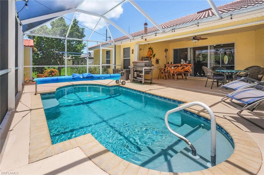 GREAT PRICE CORRECTION!! Welcome to your new SW Florida paradise! If you’re looking for an immaculate pool home with ALL ASSESSMENTS PAID in the sought-after area of SW Cape Coral, you can stop your search! This 1815 sq ft open-concept home offers 3 bedrooms plus a den, 2 bathrooms, and a HEATED pool. Beyond those basics, take a look at these awesome features of this well-maintained beauty: mature landscaping, fully fenced backyard, newer appliances, tile roof, NO carpet in the house (tile throughout), vaulted ceilings, jacuzzi tub in master bathroom, walk in closet, freshly painted inside and out less than a month ago, whole house surge protection, impact windows throughout & accordion shutters for the lanai, attic fan, auto irrigation, in-wall pest control, insulated cover for heated pool, new extra durable pool screen, and plenty of backyard lawn for the family pooch. Not to mention there is an amazing matching 10x16 shed for plenty of storage in the backyard. Sellers also have flood insurance that is assumable at the grandfathered rate for a huge savings! This phenomenal home has been lovingly cared for, and it shows! Seller is MOTIVATED, so come and make this YOUR next home!