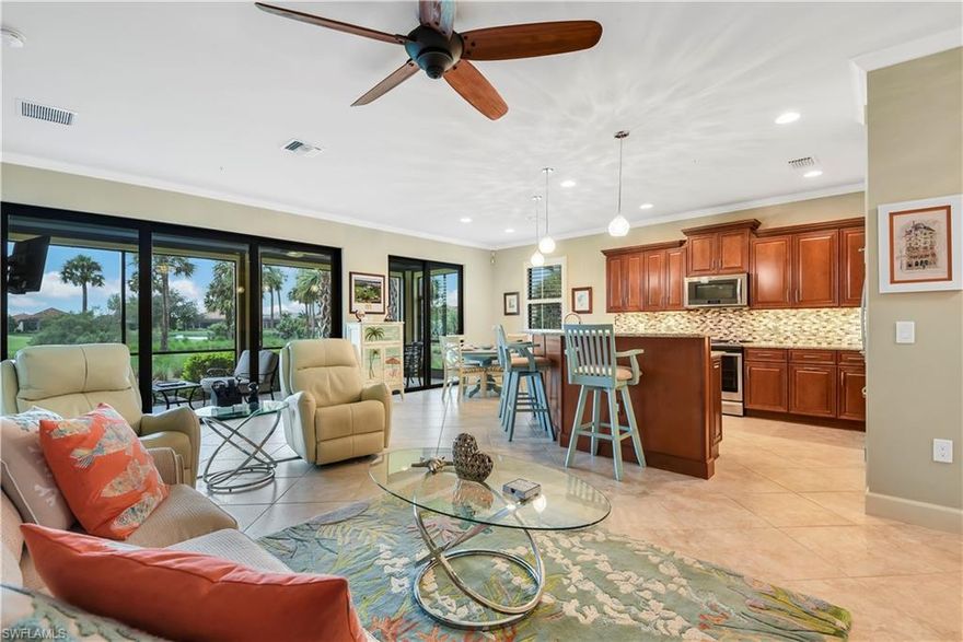 WORLD CLASS 36 HOLES OF CHAMPIONSHIP GOLF BY J.NICKLAUS AND S.SMYERS. This gated home has a golf membership, with 614 limited golf members. Pristine first floor coach home with spacious open concept living area. Lanai view of the 8th green and scenic lake. Kitchen has upgraded wood cabinets with granite counter tops and custom tile backsplash. High 8ft doors throughout. Crown molding in living area and Master. This home has 3 wood floor bedrooms. All sliding doors and windows are high impact glass adding security and sound proofing. Plantation shutters, ceiling fans and upgraded lighting. Interior diagonal tile floor continues out to the lanai. Storm Smart electric lanai screens. Upgraded 2 car garage with epoxy painted floor, extra electrical outlets and 16' of hanging storage. Over $85K in upgrades. The spacious Clubhouse is poised for renovation/expansions. A redesigned Nicklaus golf course and new Bocce courts. In addition to Tennis and Pickleball courts, enjoy the 6,430sf Fitness Center’s new equipment with adjacent community pool and Tiki. Stroll among wildlife walk/bike paths adds to the serene atmosphere of TwinEagles. $30K initiation fee waived until 04/01/2021.