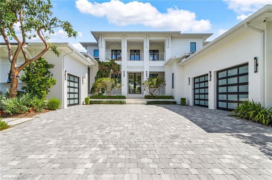 Nestled in the prestigious Estates area of Marco Island, this extraordinary water-direct home is a true gem. Custom Built in 2021 by the Marco Island builder, The Lykos Group, this home boasts over 125 feet of dock frontage and direct access to the open Gulf waters in just minutes. This meticulously crafted home spans over 6200 square feet under air with a total of more than 9,000 square feet overall. Every detail has been thoughtfully designed with no expense spared, creating an exquisite living experience. The gourmet kitchen is a culinary dream, equipped with top-of-the-line appliances, including Sub-Zero - Wolf appliances with a 48” gas range and two dishwashers. Complete Caterer’s kitchen with double ovens, refrigerator, and two dishwashers. The large first floor laundry includes lots of storage. Grand entry leads to the Great room with a living and dining area, including a custom walnut wet bar and a walnut built-in fireplace. The family room leads to a generous outdoor living space with a bar with ample seating, fireplace and sitting area, outdoor kitchen and pool bathroom with storage. The first floor includes a generous master suite with an attached study/den. Finally, the first floor also includes a guest suite with direct access to the garage entry. The second floor includes an additional 3 full-size bedrooms, each with its own full bathroom. The second floor also includes a loft, family room, laundry room, full bathroom, and wet bar. The second-floor bedrooms and the family room have access to two covered balconies. The expansive lanai has an infinity pool with spa, pool enclosure, plus motorized screens and hurricane shutters. The dock area is designed for luxury living, with two boat docks featuring a boat lift, jet ski lift, and paved fire pit area that wraps around the end of the canal. 1000-gallon propane tank with whole house generator. Complete with oversized 3 car garage, and private 3 floor elevator. This home also offers luxurious well-designed landscaping and amazing lighting throughout the entire property. AI state of the art security monitors the entire property. With unmatched craftsmanship this is an unparalleled opportunity to own a piece of paradise in Marco Island, combining luxurious waterfront living for your perfect sanctuary.