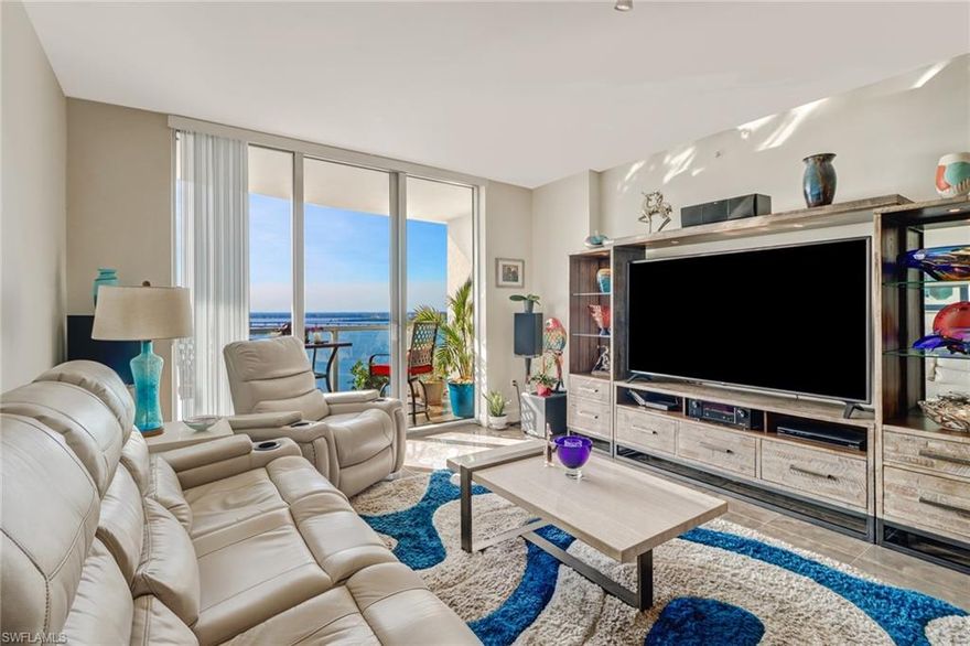 GREAT Price / Quality! Modern contemporary look from the 20th Floor with incomparable water views! This very fresh touch makes you feel at home immediately. Indulge in the classy kitchen with GE Monogram and Bosch appliances; granite & marble countertops. Many upgrades including, new paint, new water heater and pressure valve, whole house surge protection, September 2019 a new whole house water filtration system, new stainless back splash, new light fixtures including new can lights over the breakfast bar and dimmer switches.
Floor to ceiling IMPACT windows and glass balcony railings allow for spectacular views! FIRST CLASS AMENITIES: include a resort style pool with Spa, a state-of the art fitness center, saunas, tennis courts, business and billiard rooms, a library and concierge services. Meet friends in the lounge, billiards room & entertaining room. Covered parking in the attached garage. Located close to the Downtown River District with restaurants, bars, shops & galleries - you will love the RELAXED, EASY & CAREFREE lifestyle of a modern resort-style high rise. Bring your suitcase and enjoy this contemporary lifestyle! EXCELLENT PRICE - incl. 1 covered parking spot.