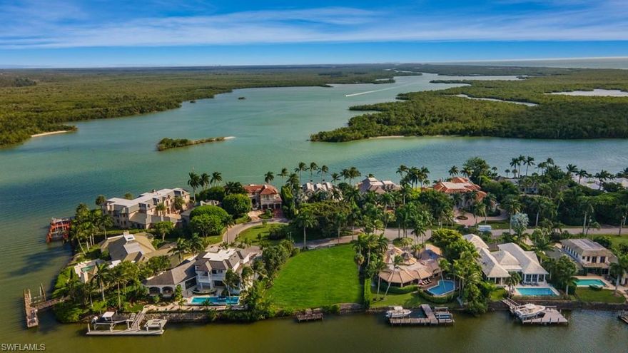 Build your dream home on this incredible Port Royal building site located on Admiralty Parade. This highly sought after property measures 188 feet of depth, with 122 feet on the water totaling just under 23,000 square feet. This cleared building site will accommodate a spacious custom built home of over 6200 square feet under air. Architectural renderings show the possibility of  a home with 5 bedrooms, 5 and 1/2 bathrooms, den, office, 4 car garage, pool, spa and large outdoor living space.  In addition, this home site is eligible for a Port Royal Club Membership. The Port Royal club offers first class amenities including a fitness center, spa, tennis courts, fine dining, and private beach access.