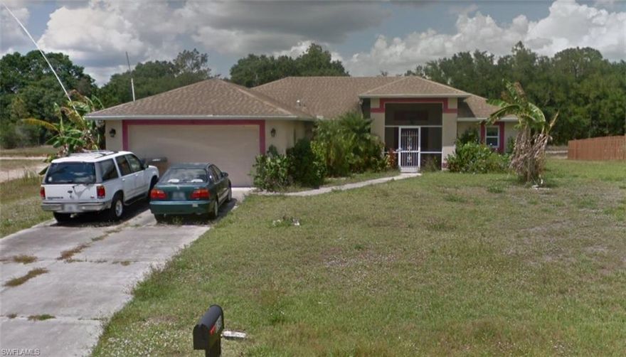 A beautiful 4 bedroom, 2 bathroom pool home in Lehigh Acres on an large lot.