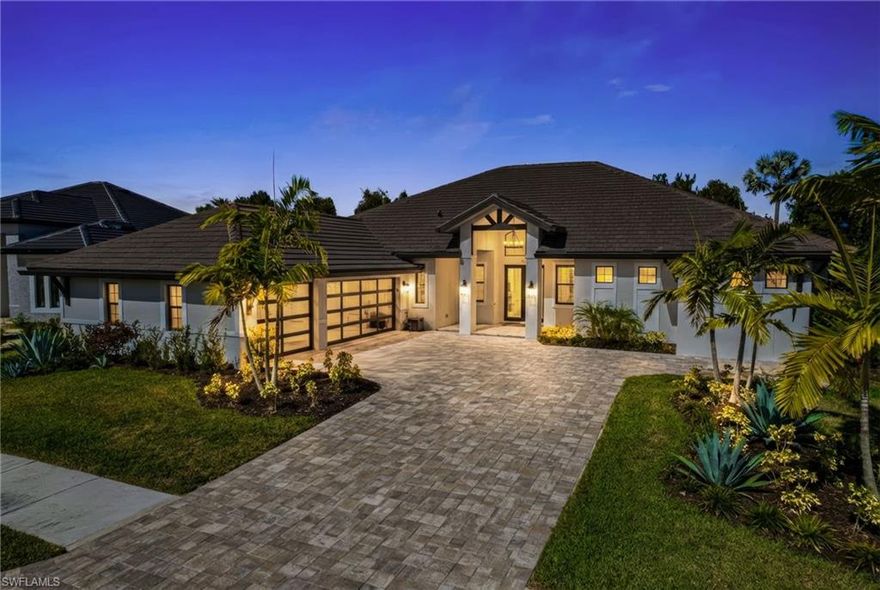 Experience refined luxury in this exceptional estate located in Parrot Cay, one of the most desirable neighborhoods in Naples Reserve. Thoughtfully designed for seamless indoor-outdoor living, this residence offers an exceptional blend of elegance, comfort, and modern sophistication.

The inviting foyer opens to an expansive great room, where walls of sliding glass doors bathe the space in natural light and frame views of a private outdoor retreat. The open-concept design is ideal for both intimate gatherings and effortless entertaining, flowing beautifully to a resort-style lanai. Here, enjoy a saltwater pool and spa, thoughtfully designed lounge and dining areas, and a fully appointed outdoor kitchen with gas grill.

Inside, the home features an elegant dining area, wine bar, and a chef’s kitchen with stainless steel appliances, quartz countertops, and under-cabinet lighting. A versatile den provides flexibility as a home office or optional fourth bedroom.

The private owner’s suite is a true sanctuary, offering a dedicated sitting area, tray ceilings, recessed lighting, dual walk-in closets, and spa-inspired vanities. The luxurious bath is complete with a walk-through shower and separate soaking tub, creating a peaceful space to unwind and restore.

Recent enhancements further elevate the home, including brand-new hurricane impact garage doors and front entry door, a custom outdoor kitchen, an upgraded saltwater pool system, and curated exterior lanai lighting with digital controls and timers.

Residents of Naples Reserve enjoy an exceptional lifestyle with access to resort-style amenities including a clubhouse, zero-entry pool with lap lanes, fitness center, café, fire pit, lakefront beach with volleyball, tennis and pickleball courts, bocce ball, dog parks, boat ramp, miles of scenic walking paths, and a soon-to-be-updated clubhouse featuring an outdoor bar.