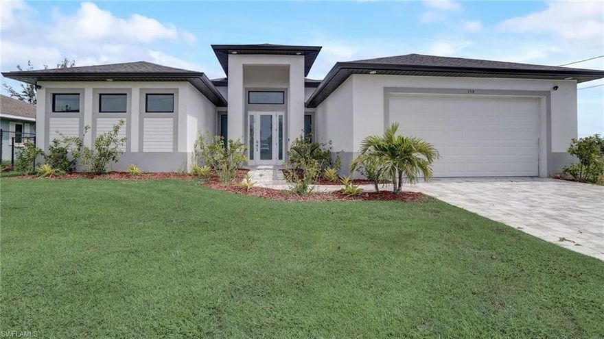 Beautiful amazing waterfront home located on a freshwater canal. Extra large pool lanai with plenty of room to enjoy, entertain or relax looking at the great outdoors! This beautiful home shows like a model home. Tastefully decorated in neutral colors.  3 Bd 2 Bth, Ceiling fans in all rooms and 2 in the Lanai. Spacious Master bathroom with his and her closets plus a separate linen closet. This property can also be a ready-to-go Airbnb investment. The furniture can be negotiated. There are many upgrades such as the Epoxy garage floor, lighting fixtures,  landscaping, and seawall. The pool is wired for a heater. The owner used this property just a few times so it's practically like new! Centrally located near the best restaurants, shopping, entertainment, and grocery stores. Fully fenced in.  Water, sewer, and irrigation Assessments are paid in full.