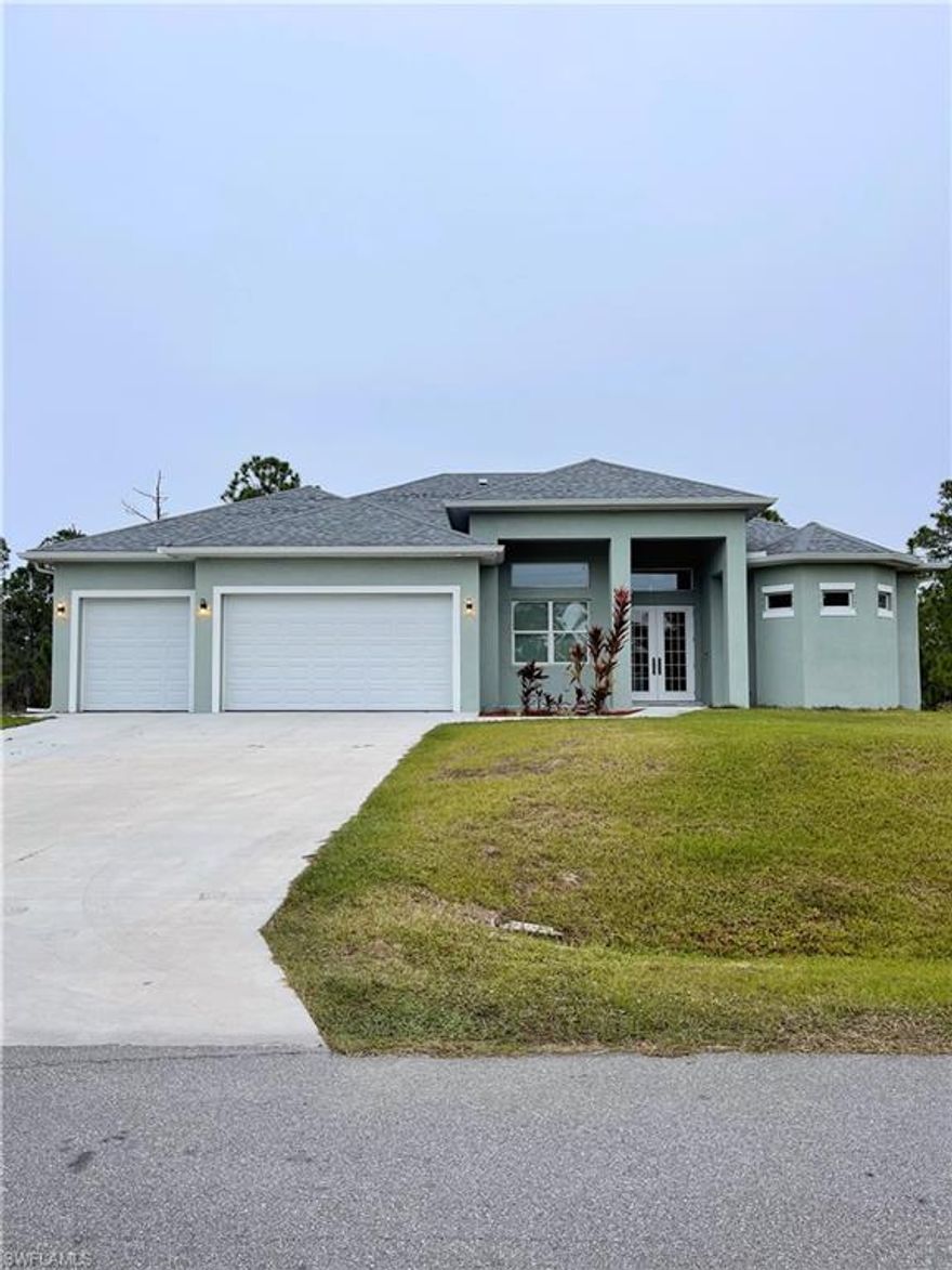 Custom Built home 2020 that is spacious with over 2,300sqft under air and 3,708 square feet total! Home has tiled covered patio as well as tile in entry. Tall ceilings thru out the home. Home also has built in Bluetooth speaker system in patio and living room. Home has hook up for outdoor kitchen. The master bedroom is spacious measuring 16x14 with a spacious master bath that has bath and shower with double sink and make up area. Don’t miss the opportunity to own a unique custom built home in Lehigh Acres.