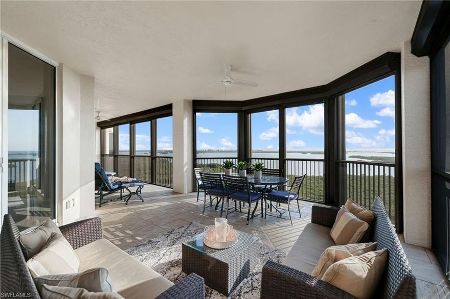 High above the natural beauty of Southwest Florida, this stunning sky residence on the 17th floor of The Colony at Pelican Landing offers breathtaking panoramic views of Estero Bay, the sparkling Gulf of Mexico, and the surrounding protected nature preserves. This beautifully appointed three bedroom, three and a half bathroom home welcomes you through a private elevator entry into expansive living spaces filled with natural light and framed by walls of glass that showcase the remarkable scenery from nearly every room.

The open floor plan is designed for both comfort and entertaining, featuring a spacious great room, an elegant dining area, and a gourmet kitchen thoughtfully equipped with premium appliances, granite countertops, custom cabinetry, a generous breakfast bar, and a full size wine refrigerator that is perfect for storing and serving your collection.

The primary suite offers a peaceful retreat with floor to ceiling windows, direct balcony access, and a luxurious ensuite bath with dual vanities, a soaking tub, and a walk in shower. Two additional guest suites provide privacy and comfort for visiting family and friends, each with its own ensuite bathroom.

Step outside to the expansive screened terrace, an ideal setting to enjoy morning coffee as the sun rises or relax in the evening with sweeping water and sky views. Additional features include a separate den that works beautifully as a home office or reading space, a powder room, and a dedicated laundry room.

Residents of The Colony enjoy an exceptional collection of amenities including a private beach park, tennis and pickleball courts, a fitness center and spa, resort style pool, kayak park, and full service concierge services. The private The Bay Club at The Colony offers waterfront dining exclusively for residents, where beautiful views complement an elegant dining experience. Golf enthusiasts also have the opportunity to join The Colony Golf & Country Club.

Ideally located just minutes from shopping, dining, and entertainment at Coconut Point, this residence offers an exceptional opportunity to enjoy refined high rise coastal living surrounded by breathtaking natural beauty.