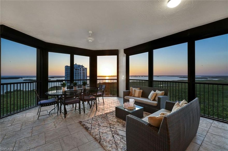 High above the natural beauty of Southwest Florida, this stunning sky residence on the 17th floor of The Colony at Pelican Landing offers breathtaking panoramic views of Estero Bay, the sparkling Gulf of Mexico, and the surrounding protected nature preserves. This beautifully appointed three bedroom, three and a half bathroom home welcomes you through a private elevator entry into expansive living spaces filled with natural light and framed by walls of glass that showcase the remarkable scenery from nearly every room.

The open floor plan is designed for both comfort and entertaining, featuring a spacious great room, an elegant dining area, and a gourmet kitchen thoughtfully equipped with premium appliances, granite countertops, custom cabinetry, a generous breakfast bar, and a full size wine refrigerator that is perfect for storing and serving your collection.

The primary suite offers a peaceful retreat with floor to ceiling windows, direct balcony access, and a luxurious ensuite bath with dual vanities, a soaking tub, and a walk in shower. Two additional guest suites provide privacy and comfort for visiting family and friends, each with its own ensuite bathroom.

Step outside to the expansive screened terrace, an ideal setting to enjoy morning coffee as the sun rises or relax in the evening with sweeping water and sky views. Additional features include a separate den that works beautifully as a home office or reading space, a powder room, and a dedicated laundry room.

Residents of The Colony enjoy an exceptional collection of amenities including a private beach park, tennis and pickleball courts, a fitness center and spa, resort style pool, kayak park, and full service concierge services. The private The Bay Club at The Colony offers waterfront dining exclusively for residents, where beautiful views complement an elegant dining experience. Golf enthusiasts also have the opportunity to join The Colony Golf & Country Club.

Ideally located just minutes from shopping, dining, and entertainment at Coconut Point, this residence offers an exceptional opportunity to enjoy refined high rise coastal living surrounded by breathtaking natural beauty.