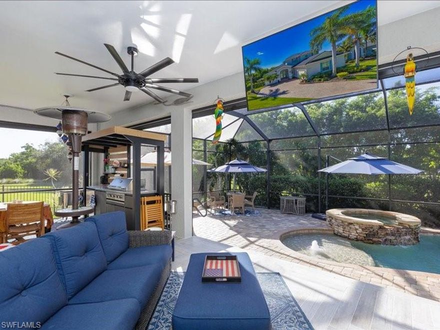 Experience the pinnacle of stress-free Florida living in this masterfully designed residence in gated Catalina Isles. This ready to move in  home blends high-end luxury with the comfort and ease of Florida living, featuring a new charcoal metal roof (2024), dual high-efficiency A/C units (2022/2024), and comprehensive storm protection including electric hurricane screens.
The chef’s kitchen is a showpiece of culinary excellence, boasting stainless steel double ovens, an oversized island with built in beverage fridge and wine cooler, and custom dual pot fillers. The first-floor primary suite offers a private, spa-like retreat with dual walk-in closets and a soaking tub. Luxury extends to the car enthusiast's dream garage, featuring 12-foot ceilings and a professional car lift offering 3-car capacity and electric vehicle charging capability .
Outside, your private oasis awaits with a heated pool and spa (new heater/pump 2023) and a built-in summer kitchen, all framed by a lush, fenced yard with reclaimed irrigation. With low HOA fees covering cable and lawn maintenance, this home is designed for ease of living and sophisticated comfort. Refinement in every detail. Serenity in every corner