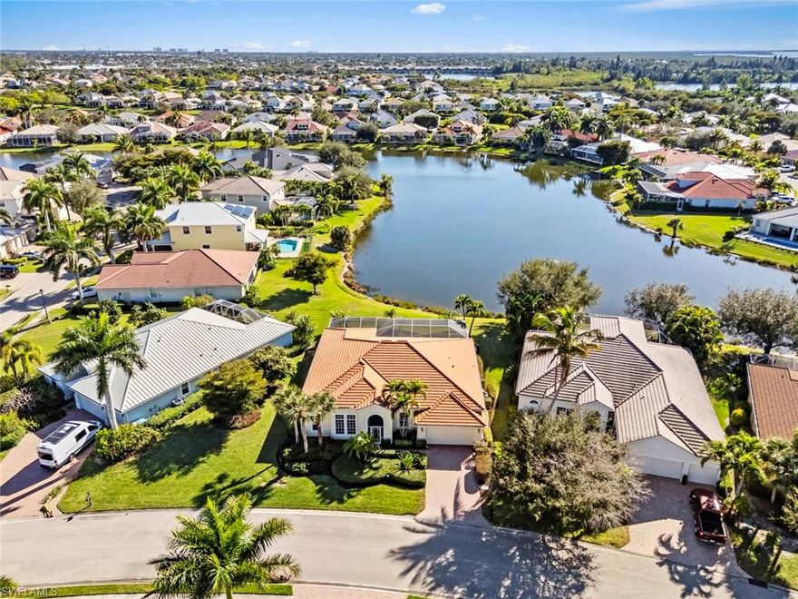 Welcome to Sandoval - one of Cape Coral’s most desirable gated communities - where lake views, thoughtful design, and resort-style amenities come together to create everyday Florida living at its best. From the moment you enter the neighborhood, you feel the balance of privacy, community, and relaxed coastal living that makes this area so special.

Situated on a quiet street, this turnkey 3-bedroom + den, 3-bath residence offers nearly 2,500 square feet of well-planned living space with a bright great-room layout and split bedroom design for privacy. Large windows and sliding doors fill the home with natural light while framing peaceful lake views, creating a calm and welcoming atmosphere the moment you step inside.

The kitchen is designed for both functionality and entertaining, featuring an island, pantry, double ovens, and generous prep space that opens naturally to the main living area - ideal for gathering with family or hosting friends without missing a moment. The primary suite feels like a private retreat with dual vanities, a soaking tub, and walk-in shower, while the den provides flexible space for a home office, guest room, or creative studio.

Step outside to your screened lanai and private below-ground pool, where mornings begin with coffee overlooking the water and evenings wind down with sunset reflections across the lake. This indoor-outdoor connection is what Florida living is all about - effortless, peaceful, and designed to be enjoyed year-round.

Sandoval residents experience a true lifestyle community with clubhouse, resort and lap pools, fitness center, pickleball, tennis, fishing pier, dog park, and scenic walking paths - all just minutes from shopping, dining, and schools.

This home blends comfort, quality construction, and a serene lakefront setting within a vibrant, amenity-rich neighborhood - ready to enjoy from day one and designed for the way you want to live.