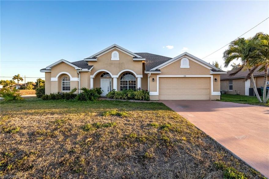 Beautiful, spacious home on oversized corner lot in heart of Cape Coral. This home features 4 bedrooms and 2 baths. The home features vaulted ceilings in entry areas along with tray ceilings in living room and master bedroom! There is a formal living room, a separate family room, a formal dining room and a nook off the kitchen. Other features include large master bath, walk in closets, stainless appliances, side access garage door, and tile in the wet areas.  Located in flood zone X, confirm with lender but typically no flood insurance required!