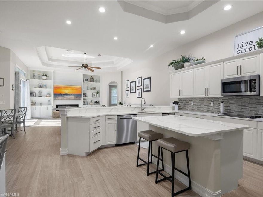 Opportunities of this scale and condition seldom present themselves within Veridian & 33908. Behind the gates, this extensively renovated residence - completed in 2023 - delivers just under 4,000 square feet of living that would be difficult to reproduce in today’s market. The thoughtfully designed floor plan offers five bedrooms, a dedicated office, and four full bathrooms, anchored by an open-concept kitchen finished with quartz countertops and a family room that opens to a private outdoor enclave with a pool and built-in grill. Positioned among the largest homes in the community, the residence occupies a rare place at the top of the neighborhood’s size profile. Engineered for resilience, the home is equipped with Storm Smart electric storm protection along with Bahama and accordion shutters, forming a layered system designed to safeguard both structure and occupants. Beyond storm protection, automated screens reduce heat and UV exposure while supporting privacy, insect control, and comfortable open-air living year-round. Soaring 12-foot ceilings and refined architectural details add volume and presence throughout, while concrete block construction and a large three-car garage reinforce durability and long-term peace of mind. Ideally located near the Caloosahatchee River with direct Gulf access, the home is minutes from Sanibel Harbour Marina, Punta Rassa Boat Ramp, Sanibel, Captiva, Fort Myers Beach, and surrounded by premier golf courses offering year-round play.