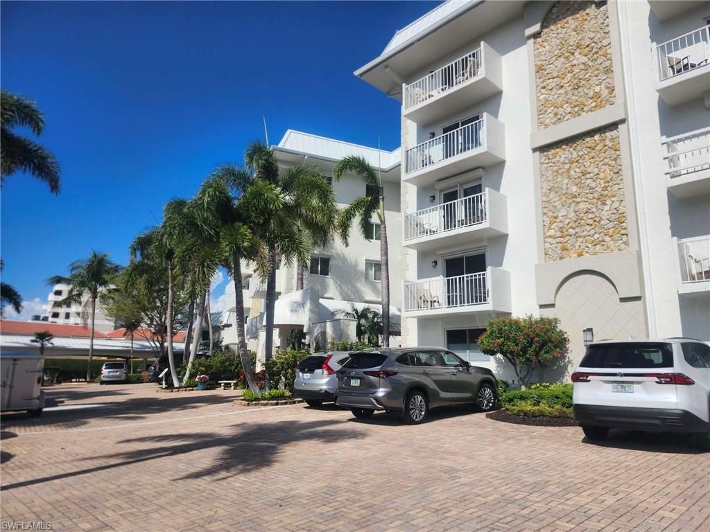 Photo of 3000 Gulf Shore BLVD N #113, NAPLES, FL 34103 (MLS # 226011703)