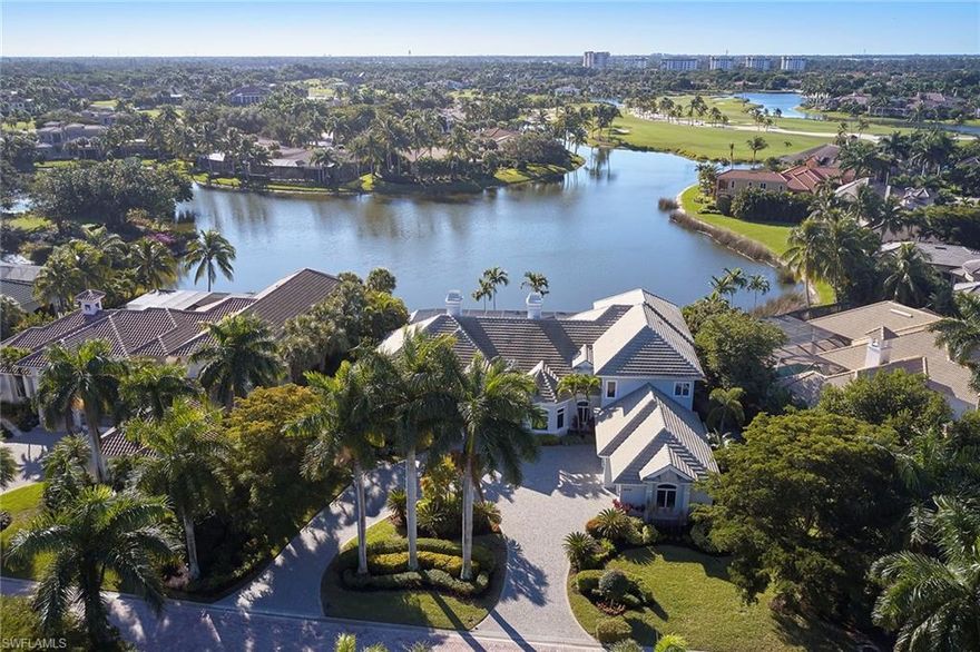 Rarely does a custom estate with this type of long-range southern lake view come on the market in Grey Oaks. Wide water views can be seen from nearly every room in this over 5,000 square foot 5-bedroom plus den open and bright great room floor plan. The large kitchen with granite countertops includes a Thermador professional range and Sub-Zero refrigerator and opens to a spacious dining area and great room with floating gas fireplace and four-panel sliders overlooking the pool and lake view beyond. The substantial covered outdoor living space and sparkling pool are perfect places to enjoy the Naples lifestyle and to entertain family and friends. Additional features include a private den with gas fireplace, study with built-in bookcases, a first-floor private VIP suite, second-floor flex room with a balcony overlooking the long lake view and a three-car attached garage. A world of luxury awaits you in Grey Oaks Country Club, close to world-class shopping, music, arts, dining and beaches.