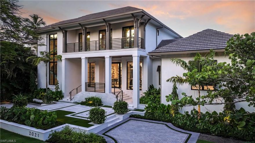 London Bay’s collaboration with Stofft Cooney Architects and Exteriors by Koby Kirwin creates a unique estate expressing coastal contemporary architecture offering seamless indoor-outdoor connections throughout. Featuring an elevated interior design with finishes and furnishings, by Romanza Interior Design, the welcoming foyer introduces the home’s open-concept design, where the adjoining great room, dining room and a social room with a wet bar flow to distinct alfresco gathering spaces. The gourmet kitchen features a large island for casual dining and an open butler’s pantry equipped with a sink and additional appliances. The spacious club room accommodates a home office and sitting room with a private patio leading to the home’s private putting green. Spanning an entire wing, the master suite features dual walk-in closets and two luxurious bathrooms connected by a glass-enclosed shower. The well-appointed bedroom enjoys a sunny sitting area and allows for direct access to secluded alfresco destinations. As the focal point of the estate’s outdoor areas, the pool’s custom design features a sun shelf for chaises and a spa seemingly floating on the water’s surface all surrounded by the tropical landscape. An expansive lanai offers covered dining and living spaces with a thoughtfully designed outdoor kitchen, seating area, fireplace and pool bath along with the convenience of motorized screens and shutters. The second floor offers a large loft with a wet bar, additional laundry and four spacious en suite bedrooms, each with direct access to balconies. The residence also offers the conveniences of a three car-garage, elevator, natural gas, and generator.
This prime corner site is conveniently located just steps from the beach and within walking distance to the Third Street shops and restaurants.