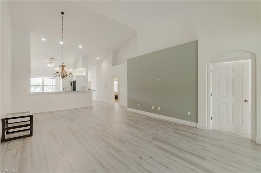 Recently updated second floor condo with soaring vaulted ceilings, new vinyl flooring throughout and a beautiful lake and clubhouse view.  This 2 bedroom, 2 bath & open den condo offers a premium location within close walking distance to the Sabal Palm community pool and the Main Grandezza pool.  Recently painted in neutral colors and ready for a new owner to use this season!
Grandezza is within close walking distance to the Publix shopping center, Miromar Outlets, Hertz Arena and more.  Minutes from the RSW airport and FGCU.