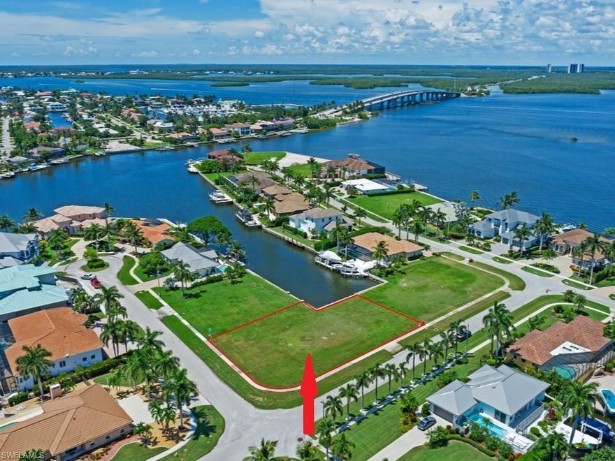 Jump on your boat from your backyard dock, travel down a short waterway and around a corner and in just moments, you are boating along the Marco River and in less than 5 MINUTES, you are on the GULF! Enjoy the phenomenal LONG WATER VIEWS from this CLEARED OVERSIZED WATER DIRECT lot in the HIGHLY DESIRABLE and PRESTIGIOUS neighborhood! Build your forever dream home on this PRIME homesite with approx .37 acres ... plenty of room for a home with a 3+CAR GARAGE and/or GUEST HOUSE near newer and under construction LUXURY homes! Potential SAVINGS on impact fees for the new owner as the previous house has been demolished. NEW SEAWALL in 2004. Sewer assessment paid.