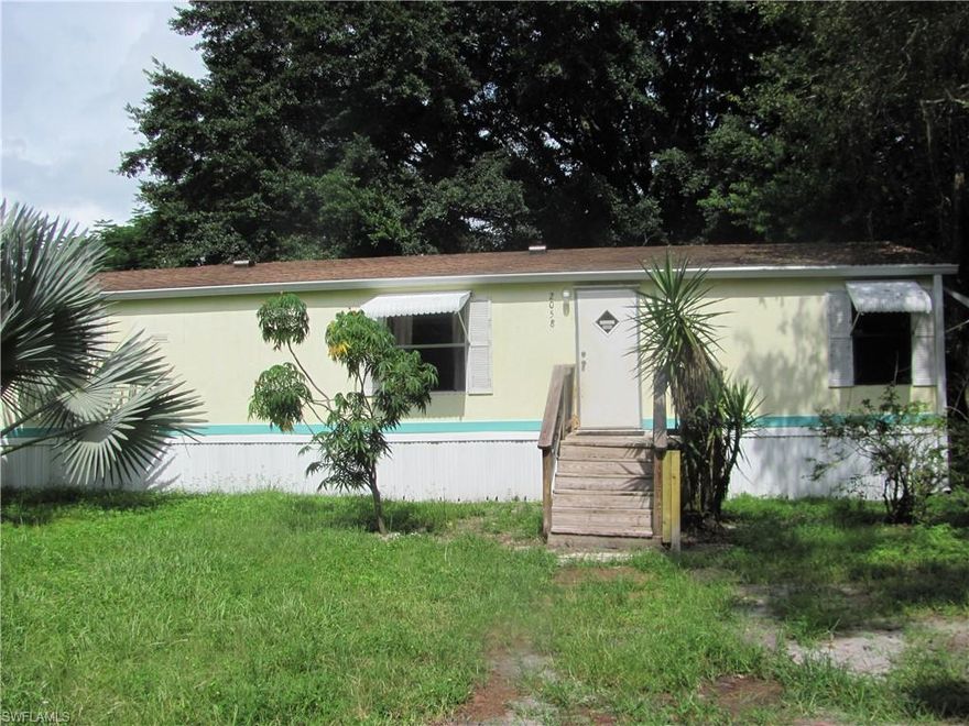 If living in North Ft. Myers on a property that is over half an acre and fenced and crossed fenced with 6 ft. chain link and is close to everything, than this 1991 mfg. home is perfect for you.  It can be financed VA or FHA and it has all new kitchen cabinets, new flooring and vaulted ceilings.  It has a large great room and a terrific yard for kids and pets.  The road was just repaved by the County, the A/C unit is only 4 years old and it has 3 full bedrooms and an office or hobby room for the new buyer.
