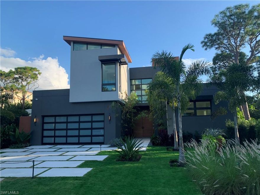 This home is pending. HOMESITES ARE AVAILABLE TO DUPLICATE HOME NEARBY. Meticulously crafted by Naples only Florida Home Builders Association “Builder of the Year”, Kaye Lifestyle Homes Custom Home Division offers the finest of Modern Mid-Century Design. Located at the end of a private cul de sac, enter through the Zen garden and 10' custom walnut doors. This bright and open concept lends itself perfectly for entertaining and year-round living. A spacious great room with floor to ceiling impact sliders flows into a gracious modern dining room overlooking your covered outdoor entertaining area.  The chef’s kitchen features custom matched maple cabinets with the finest appliances. The oversized en-suite den doubles as both a study and retreat. Your large lanai features a deluxe outdoor kitchen, generous entertaining area and linear pool/spa.  On the second level you’re greeted with a loft overlooking the foyer, a wet bar dedicated for entertaining and two additional en-suite bedrooms.   
Walking distance to Waterside Shops, and Clam Pass is just  a tram ride to the beach!