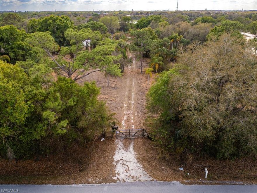Discover a rare opportunity to own 9.66 acres of beautifully wooded land just off SR-29 and minutes from downtown LaBelle. This private, fenced parcel offers the perfect blend of seclusion and convenience, featuring a scenic pond, lush green grass, and an abundance of mature oak trees, pines, and native vegetation that create a peaceful Old Florida setting.

Formerly operated as a tree nursery, the property already has valuable improvements in place, including existing well, septic, and electric, saving a future owner significant time and development costs. A gated entrance and established drive provide easy access, while the expansive acreage offers endless possibilities—build your dream estate, create a private retreat, start a small farm, or hold as an investment.

There are a couple of older structures on site that are considered to have no contributory value, giving you a clean slate to design and build exactly what you envision.

Offered at $399,000, this is a unique chance to secure a sizable, improved parcel in a desirable location close to town yet surrounded by nature.