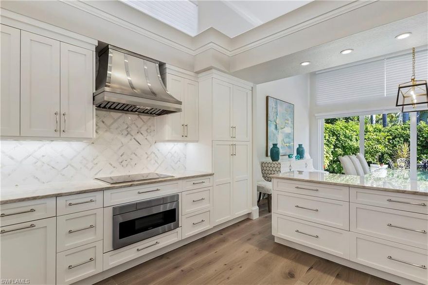 Nestled in the prestigious community of Pelican Bay, this beautifully remodeled home represents the pinnacle of luxury coastal living in Naples. Boasting southern exposure, the property has undergone extensive renovations to offer a contemporary and sophisticated living experience. Inside, the home features three state-of-the-art HVAC units, including in the garage, ensuring comfort throughout the seasons. As you enter, you will be captivated by the amazing courtyard featuring a pool and spa. The residence offers four bedrooms and four baths, each thoughtfully designed to maximize space and luxury. The interiors are adorned with white oak floors, enhancing the natural light that floods each room. The home's plumbing, electrical systems, and light fixtures have been completely updated, reflecting a commitment to quality and modernity.
The kitchen is a chef’s delight, equipped with high-end Sub Zero appliances and sophisticated fixtures, making it perfect for both everyday living and entertaining. Living in Pelican Bay offers access to an array of exclusive amenities. Enjoy the community's pristine private beaches, stretching over three miles along the coast, with convenient tram transport. Additional facilities include two tennis courts, a wellness center, and a 27-hole championship golf course, ensuring entertainment and relaxation options are always at hand. This villa is more than just a home; it is a sanctuary where luxury meets natural splendor, inviting you to elevate your lifestyle and experience the finest living Naples has to offer.