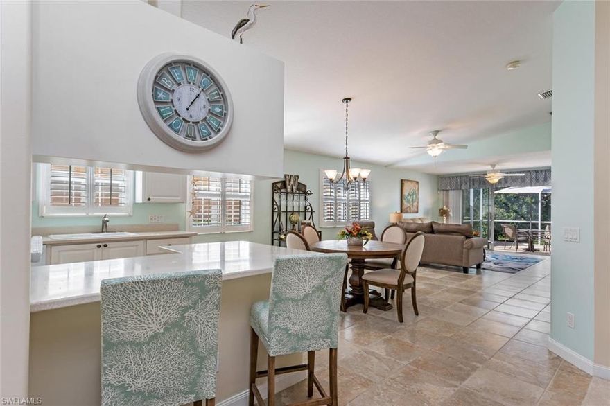 Best Capri Model on the market in Village Walk of Bonita Springs! Cul-de-sac lot that overlooks the canal with lush, well manicured landscaping for privacy.  As you walk into this home, you'll immediately feel relaxed with the spacious layout, high ceilings and extended lanai. You'll love the sparkling white kitchen with pull out cabinetry drawers and plantation blinds. The bright laundry room has plenty of cabinetry  which leads out to the meticulous garage, which has many upgrades including epoxy flooring.  After you look at the beautiful interior, you'll notice that the exterior of the home is just as wonderful.  Notice the new exterior accordion shutters! Convenient and easy to use. Village Walk amenities are hard to beat and recently updated.  This includes Bocce, pickle ball courts, lighted tennis courts, 24/7 fitness center, resort style pool with lap pools, restaurant, car wash, gas station and full time Activities Director.  Make your appointment to view this villa today! We are ready for offers!