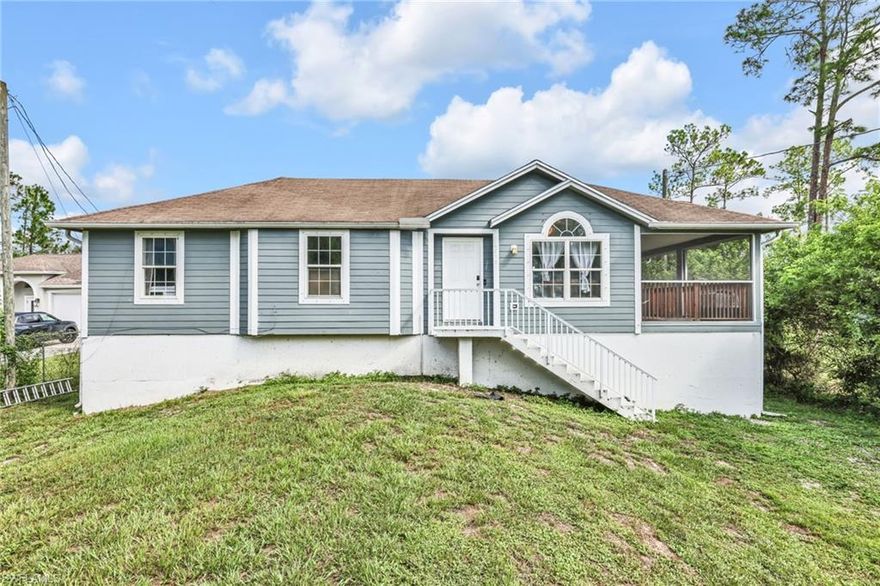 ***PRICE IMPROVEMENT*** Step inside this elevated 3-bedroom, 2-bath home built in 2018 and feel the openness immediately. Vaulted ceilings and an open-concept layout make everyday living and entertaining effortless, whether you’re keeping an eye on the kids or hosting friends. The kitchen features stainless steel appliances, quartz countertops, and modern finishes throughout, with a washer and dryer included for a seamless move-in.

From the living area, sliding doors open to a screened, covered lanai balcony—the perfect spot to enjoy your morning coffee or unwind in the evenings while overlooking the peaceful surroundings. Beneath the home, the elevated design provides generous covered storage for outdoor gear or seasonal décor.

Set on a 1.14-acre lot, the property blends open yard space with natural wooded areas and hedges for added privacy. There’s plenty of room to design your dream backyard—add a pool, garden, or create a custom outdoor kitchen.

Located in Golden Gate Estates, this home offers quiet privacy with convenient access to daily essentials. Palmetto Elementary is 4 miles away, Cypress Palm Middle is 6 miles away, and Publix is only 7 miles away. With well and septic utilities, manual shutters, and no HOA, you’ll enjoy both comfort and freedom to make this home uniquely yours. Schedule your showing today.