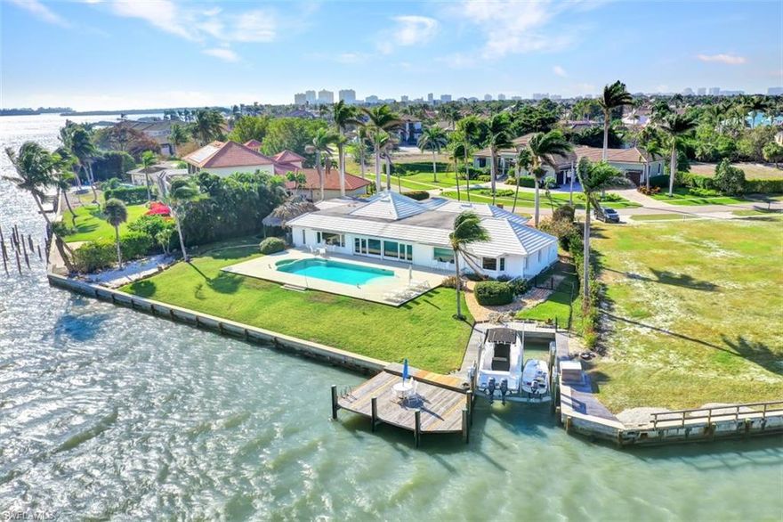 One of the best waterfront locations on all of Marco Island. 


This exquisite property features a .57 acre water-direct lot, 197 feet on the water, AND a rare, large inset boat slip with a 24,000lb lift. Located in the prestigious Estates section of Marco Island, this home features spectacular wide, unobstructed ,long water views of Caxambas Bay and the 10,000 Islands beyond. Offering easy access to Caxambas Pass, the Gulf, and 10,000 islands, this is truly a boater's paradise. You will not find a more tranquil location on our beautiful island!


The house is a well preserved, updated, open home built in the 70s that offers a cool, relaxing vibe. Nearly every room in the house draws the eye to the large pool/patio area and the amazing, serene view beyond. Boasting 4,250 feet under air with 4BR, 4BA, and a large, open gourmet kitchen/bar area, this coastal retreat is ready to be moved into.


If you are looking to build your new dream waterfront estate on one of the best lots in  Marco island, this property is priced at lot value.