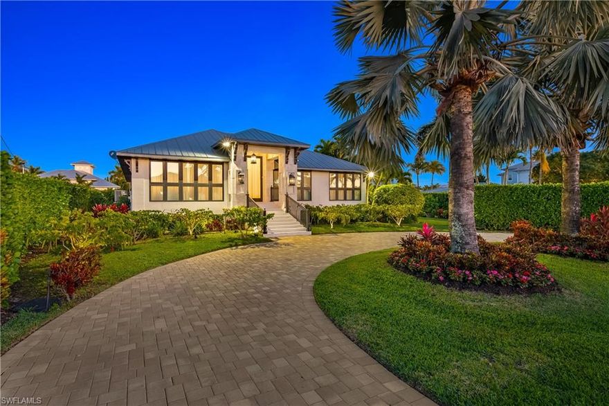 Discover refined waterfront living in the heart of Royal Harbor at this fully reimagined coastal retreat on an oversized corner lot with direct Gulf access. Thoughtfully redesigned through a complete renovation, this exceptional residence blends timeless elegance, functionality, and resort-inspired amenities just minutes from Downtown Naples and world-class beaches.
A grand front entry welcomes you into light-filled interiors defined by soaring ceilings, wide-plank wood flooring, custom millwork, and dramatic designer chandeliers. The open-concept living spaces offer a seamless flow for both everyday living and sophisticated entertaining, with expansive impact resistant sliding glass doors that connect the interior to the outdoor living areas.
The chef’s kitchen is beautifully appointed with premium custom cabinetry, striking stone surfaces, an oversized center island, and top-tier Wolf and Sub-Zero appliances. Designed for both form and function, this space opens naturally to the main gathering areas and poolside terrace, creating an effortless indoor-outdoor lifestyle.
The private owner’s suite is a luxurious sanctuary featuring custom-designed walk-in closet, elegant finishes, and a spa-inspired bath with exquisite Carrara marble, soaking tub, and oversized shower. A special highlight of the suite is the covered terrace overlooking the pool area, offering a peaceful setting for morning coffee, evening relaxation, or enjoying the tropical surroundings in complete privacy.
Guest accommodations are equally inviting, with beautifully finished bathrooms and spacious guest bedrooms enhanced by generous double closets.
Outdoor living is exceptional and designed to rival a private resort. Enjoy a deep heated pool, sauna, expansive covered lanai, custom coral and marble detailing, and a fully equipped outdoor kitchen ideal for entertaining year-round. Mature landscaping and privacy hedges create a secluded atmosphere while multiple lounging and dining spaces provide the perfect backdrop for hosting family and friends.
For boating enthusiasts, the property offers a dock, a commercial boat lift, and a dredged canal for improved water depth and reduced tide dependence. Whether enjoying a day on the water or heading out to the Gulf, this home is perfectly suited for the Naples boating lifestyle.
The air-conditioned garage is a standout feature in itself, finished with custom cabinetry, upgraded flooring, and flexible space for storage, hobbies, fitness.
Located in one of Naples’ most sought-after waterfront neighborhoods, Royal Harbor residents enjoy close proximity to 5th Avenue South, Third Street South, fine dining, luxury shopping, art galleries, and the vibrant downtown lifestyle.
A rare opportunity to own a move-in ready, meticulously maintained luxury waterfront residence where every detail has been elevated and every amenity thoughtfully considered. Experience the best of Naples living in a home that is as functional as it is beautiful.