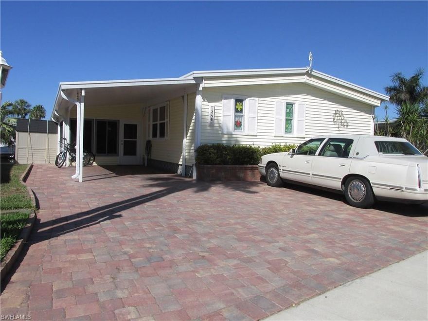 A double driveway with pavers greets you when you come pull in to this two bedroom, two bath home in Bayside Estates. There is a side lanai entrance and a bright white kitchen. This home has been updated and well cared for. From the back lanai, you have a long view down the canal. A breathtaking sunset view will await you each evening! Bayside Estates is a 55 and over, gulf access community with low fees. The community offers a wide variety of athletics and activities. Tennis, art classes, dancing classes, cards of all varieties, horseshoes, bingo, bocce and many more. Come on down and enjoy the fun.  Buyers in Bayside Estates pay a $1,900 capital contribution fee.