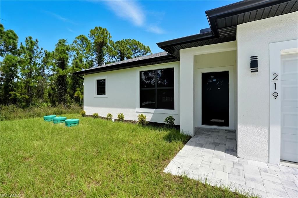 Photo of 219 Ogden AVE S, LEHIGH ACRES, FL 33974 (MLS # 226016676)
