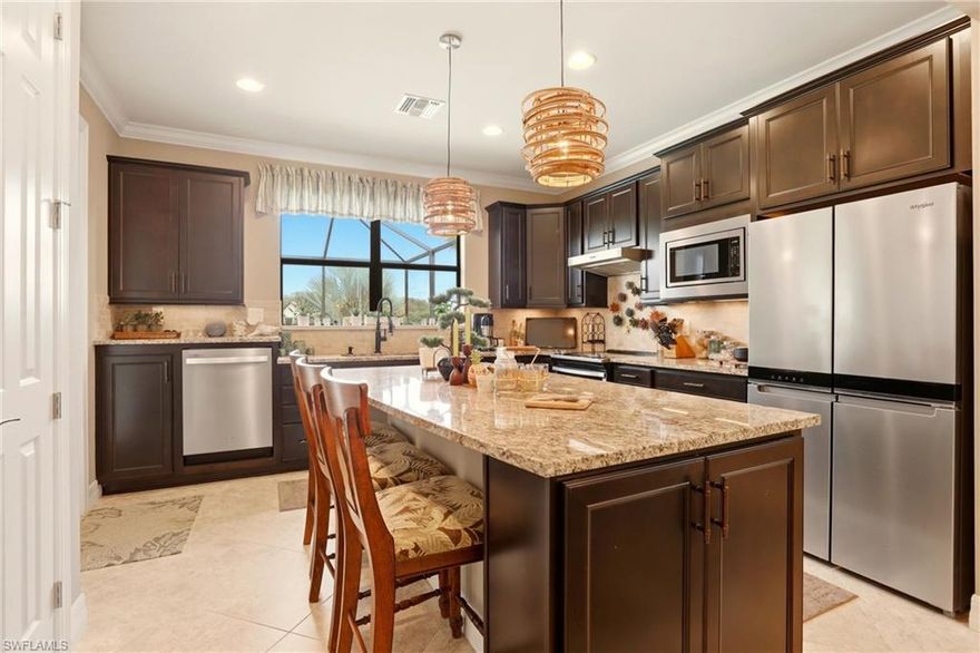 Welcome to your private slice of Florida paradise! This meticulously maintained and highly upgraded 2 Bedroom + Den, 2 Bath POOL home is the perfect retreat—whether you’re a full-time resident or enjoying the seasonal Southwest Florida lifestyle. From the moment you step inside, you’ll appreciate the warmth, openness, and natural light that make this home feel inviting and cheerful every single day.

The interior showcases thoughtful upgrades throughout, including custom plantation shutters on every window, crown molding, a stunning leaded-glass front door, decorator lighting and fans, and elegant finishes that elevate the entire home. The gourmet kitchen is designed to impress with solid wood cabinetry, upgraded stainless steel appliances, granite countertops, and an extended center island—perfect for entertaining or preparing memorable meals.

Step outside to your covered lanai oasis, where you can relax while overlooking the sparkling pool and tranquil lake views. Surrounded by lush landscaping, colorful flowers, and local wildlife, this peaceful outdoor space captures the beauty of Southwest Florida’s blue skies and sunshine.

Life in this vibrant gated community offers far more than just a beautiful home—it’s a lifestyle. Residents enjoy a grand clubhouse, state-of-the-art fitness center, two resort-style pools, pickleball and tennis courts, fire pit, tiki bar, BBQ area, and scenic walking paths around picturesque lakes—perfect for staying active, meeting neighbors, and enjoying the Florida outdoors.

Golf enthusiasts will appreciate the option to join the nearby Somerset at the Plantation Golf Course, the sister community to Bridgetown, offering even more social and sporting activities.

Conveniently located just minutes from Southwest Florida International Airport, Boston Red Sox spring training facility, Gulf Coast Town Center, Miromar Outlets, and the vibrant dining, events, and entertainment of downtown Fort Myers, this home truly combines luxury, convenience, and lifestyle.

Your invitation to own a piece of “Paradise on Earth” awaits.