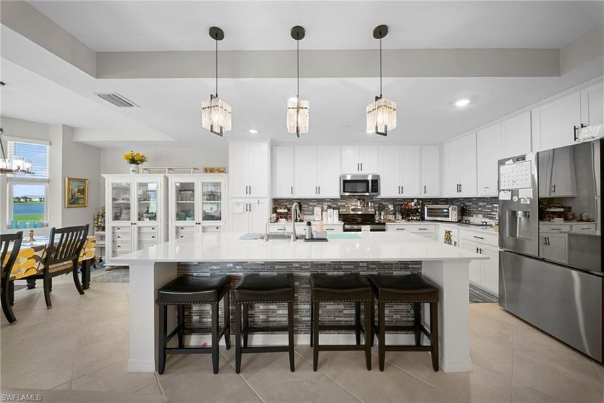 IMMEDIATE GOLF MEMBERSHIP | NO WAITLIST | BUILT IN 2024 | PRICED TO MOVE.
Experience the pinnacle of Southwest Florida living in this expertly upgraded 2024-built Birkdale model at The National Golf & Country Club. Combining "like-new" construction quality with immediate access to premium amenities, this residence is perfectly positioned to capture views of the 9th green and the community clubhouse. 
*Modern 2024 Construction: Enjoy the peace of mind that comes with recent 2022 builds, featuring the latest in Florida building codes, impact-resistant windows, and contemporary energy efficiencies.
*Designer Interiors: Open layout enhanced by custom lighting and designer fixtures. The kitchen stands out with a custom tile backsplash and upgraded stainless steel appliances.
*Scenic Vista: Large windows frame shimmering water and manicured fairways, offering some of the best natural light and sunset views in the community.
*Ultimate Convenience: This unit includes private covered parking and a dedicated storage unit located right outside your front door.
*Premier Bundled Golf: Your ownership includes a full membership to the Gordon Lewis-designed championship course, resort-style pool with chickee bar, fitness center, tennis, and pickleball. 

Located minutes from Ave Maria Town Center and just a short drive to the white-sand beaches of Naples.