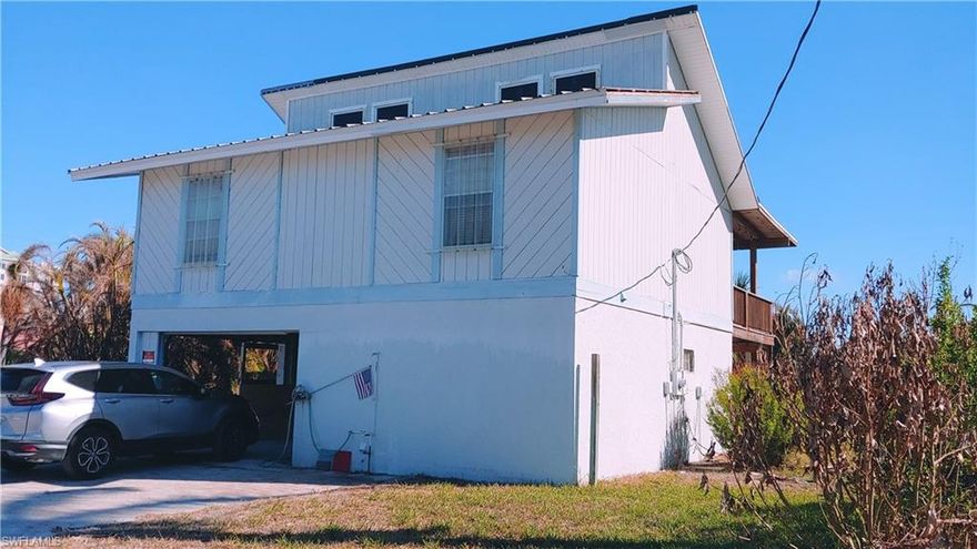 Unique Island home on south tip of Fort Myers beach. FULLY FUNCTIONAL AND READY TO LIVE IN TODAY. Located on a large corner lot steps from the beach and Lovers Key. Large back yard with room for pool and garden. 16' vaulted ceiling with a two bedroom, one bath upstairs and a 30' by 12' covered deck. 
Large downstairs with full bath, walk in closet and sliders to 30' by 12' paver deck.  Home is overlooking a park like setting, with bay water view, away from the noise of Estero Boulevard. 
Wide paver drive with extra long carport. Major price reduction. Taxes for 2022 are $2,146- (with homestead exemption).
Appraisal dated 9-26-22 of Fair Market Value of $925,000- allows for 50% improvement of $182,785- (attached to listing documents).
New hot water heater installed November 2022. New A/C installed in December 2022. 4 stage RO drinking water filter. Easy to show on short notice. In good condition and currently getting fresh paint. New roof installed January 2023 with GAF Timberline HDZ lifetime shingles. Structure report is good and attached to documents. Electric and water service are in place and working. Pictures are post hurricane. Fort Myers Beach - south tip of island. Estero Blvd. to north on Estrellita, second house on the right. Look for sign.