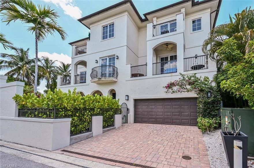 Experience the ultimate Old Naples lifestyle in this luxurious private villa, perfectly located less than a block from the iconic 5th Ave South. This stunning three-story home offers 3 bedrooms, 4 full baths, a private pool, spa, and elevator for unparalleled comfort and convenience. On the first floor, you’ll find a bedroom with two full-size beds, a full bath, and a wet bar, all easily accessible from the pool area. The second floor features an open, sunlit living room with a gas fireplace and large TV, a full bath, a dining room, and a chef’s dream kitchen complete with Arctic Ice granite countertops, Wolf and Sub-Zero appliances, and a center island. Multiple balconies extend the indoor-outdoor living experience. The third floor hosts the primary suite, which includes a king-size bed, a walk-in closet, dual sinks, a separate tub and shower, and an open-air terrace. A guest bedroom with an en-suite bath, a king-size bed, and a private terrace is also located on this floor, along with a conveniently placed laundry area. Additional features include alley access to a spacious two-car garage, a multitude of balconies for enjoying tropical breezes, and picturesque views of the city lights. All this, just a few blocks from the sandy beaches of the Gulf of Mexico, offering the perfect blend of downtown living and coastal relaxation. Live exceptionally in Olde Naples!