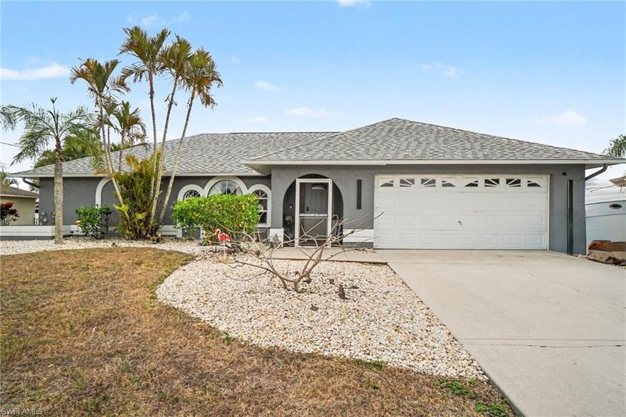 Prime Location in the Heart of Cape Coral! This beautifully maintained and thoughtfully updated 3-bedroom, 2-bath single-family home offers comfort, style, and convenience—just minutes from EVERYTHING you need; shopping, dining, entertainment, including Sun Splash Water Park and Lake Kennedy. Also located only one block from Hunter's Run Golf Course, this home is perfect for enjoying the Florida lifestyle.
Step inside to an inviting open-concept great room featuring wood-look tile flooring in the main living areas and primary suite, with wood-look laminate in the secondary bedrooms. The updated primary bathroom boasts a spacious walk-in shower and walk-in closet, while both guest bedrooms also offer walk-in closets for added storage.
The recently renovated kitchen is a true show stopper, featuring an oversized island, shaker-style wood cabinetry with soft-close cabinet doors and drawers, a convenient Lazy Susan, elegant quartz countertops, and stainless steel appliances—including an LG InstaView refrigerator, double wall oven, and a sleek induction cooktop. A large pantry with pull-out shelving provides exceptional storage and organization, making this kitchen as functional as it is beautiful.
Sliding glass doors lead from the great room to a screened lanai, opening to your own private, fully fenced tropical backyard. Enjoy lush landscaping with privacy fencing, graceful areca palms, and a stunning royal poinciana tree—plus plenty of room to add a pool.
Additional highlights include a generous laundry room with built-in cabinetry and access to the two-car garage. A new roof was installed in 2021. Located outside of a flood zone, with all assessments paid, this home offers peace of mind along with exceptional value.