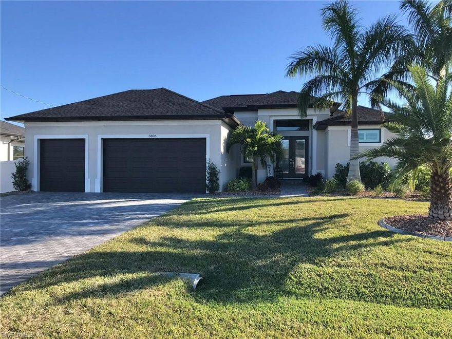 Back on the market - buyer fell through- no issue with the home. A beautiful 3 car garage pool home built in 2021 with OVER $50,000 IN UPGRADES and assessments are PAID IN FULL!!!  Fantastic location in Southwest Cape Coral near the Seven Islands! Plantation shutters and tile throughout, upgraded ceiling fan lights, canned lighting, ten foot ceilings, eight foot doors, double trey ceiling with crown in the living room, crown in the master bedroom, accent walls in both guest bedrooms, custom closet organizers, large laundry room, walk-in pantry with custom shelving.  Enjoy your Southern exposure, heated, SALTWATER POOL with a sunning shelf and water features and an oversized screened lanai to entertain all of your friends!  Impact doors and windows, Storm Smart electric screens for the back patio, 3 car garage floor has an epoxy coating and heavy duty cabinets work bench and ginormous ceiling fan! The main panel has been wired for a generator hook-up in the event of a power outage. Outside you'll find Royal Palms, Sylvester Palms, several dwarf Royal Palms, dwarf Bamboo, Clusia hedge, concrete curbing with stunning Firelight Rocks in the beds, auto sprinklers with multiple zones and a 6' privacy fence,  I tried my best, but mere words cannot describe what a beautiful home this is... schedule your showing today and see it all for yourselves!  The only reason the sellers are moving is to be closer to their parents.