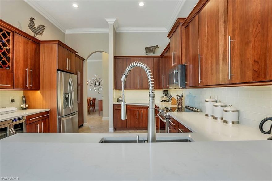 COMPLETELY UPDATED! Why wait and pay more for new construction when you can have this immaculate home Today! This popular "Aquamarine" is located at the end of a quiet cul-de-sac street and features just over 2600 sq ft, 4 Bedrooms, 3 baths, & a 3 CAR GARAGE! From the moment you walk in the custom glass front doors, you are greeted with 12' ceilings throughout, multiple transom windows that let the sun shine in, & a modern design. The BRAND NEW Custom Kitchen features solid Cherry Cabinets, Wine Bar, Wine Cooler, Quartz Counter Tops with glass tile backslash, GE Stainless Steel Appliances, and Commercial Style Faucet. Other updates and fine appointments include Diagonal Tile Flooring, Plantation Shutters throughout, Custom Curtains in the Formal Areas, Designer Light Fixtures & Fans, Crown Molding throughout, New Plush Carpet in the Bedrooms, LED High Hats, Updated Bath Vanities and Countertops, California Closets, and more! Saturnia Lakes offers a resort pool, lap pool, kiddie pool, hot tub, fitness room, dance studio, internet cafe, saunas, massage rooms, billiards room, grande ballroom, 4 clay tennis courts, playground, basket ball court, putting green, & miles of walking paths.