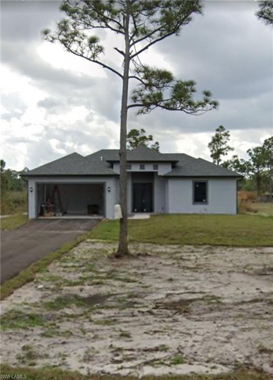 Beautiful house located in Golden Gates, two block from Everglades Boulevard. This house is sitting on a 1.59 acre lot giving you enough backyard space to build the perfect entertaining area. Modern open concept kitchen-dining and family room with 3 Beds 2 Baths, Walk-in Closets in master suite, open concept Kitchen, dining and family room, waterfall style kitchen island, granite countertops, covered lanai, high 9.4 ft., ceilings, laundry room under air, extra storage space throughout the house. Also the house is all fenced around.