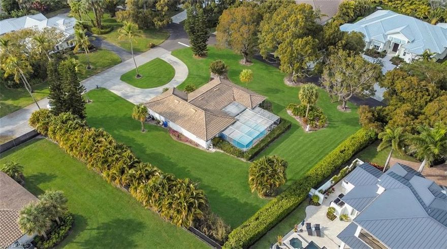 690 Murex Drive is set on a rare half acre corner lot in the heart of Coquina Sands, one of Naples’ most established and walkable neighborhoods. The southern oak lined streets are quiet, shaded, and filled with neighbors out walking dogs, pushing strollers, and riding bikes to the beach. This is old Naples living the way people picture it.

From your front door, you are approximately a 10 minute walk to Lowdermilk Park, where you have direct beach access, picnic areas, volleyball courts, and Gulf sunsets year round. You are also just a short bike ride to Fifth Avenue South for dining, shopping, coffee, and events, and close to Third Street South, Cambier Park, and the Naples Beach area. Everything that makes Naples special is right around you.

Coquina Sands is known for being pet friendly and community oriented. The neighborhood dog walking club is active, and you will regularly see small groups gathering in the mornings and evenings along the oak canopy streets. It feels residential and private, yet you are minutes from downtown and the Gulf.

The lot itself is one of the standout features. A true half acre corner homesite offers flexibility, privacy, and presence. Corner lots in this part of Coquina Sands are highly desirable because they allow for creative new construction designs, larger footprints, generous outdoor living space, and strong curb appeal. If you are looking to build your dream home in the heart of Naples, this is the type of property that supports a statement residence.

There is tremendous upside potential here for new construction. Surrounded by luxury new builds and high end remodels, this location supports significant investment. Whether you envision a modern coastal estate with a resort style pool and expansive outdoor entertaining areas, or a classic Old Naples inspired design, the setting and lot size give you room to execute at a high level.

Currently on the property is a charming 3 bedroom, 2 bath home with good bones and character. The existing residence offers flexibility. You can enjoy it as is, renovate and update over time, or use the lot as the foundation for a completely new build. The home sits comfortably on the site, and the corner positioning creates a sense of openness and space.

Opportunities like this in Coquina Sands are limited. A half acre corner lot, walking distance to Lowdermilk Park, bike ride to Fifth Avenue, and surrounded by some of Naples’ most desirable streets. Build your vision right here and create something special in one of the most sought after neighborhoods in Southwest Florida.