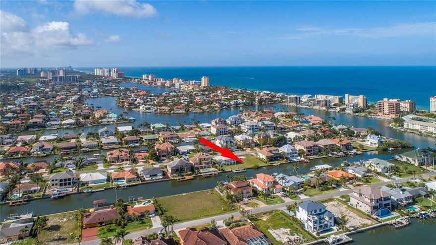This lot is surrounded by multi-million dollar homes. This gulf-access lot is ready to build your dream home! Waterfront. Short ride out to the Gulf of Mexico. Great street in the highly desirable CONNORS area, convenient to plenty of shopping, dining, including Mercato, and of course, the Beach!