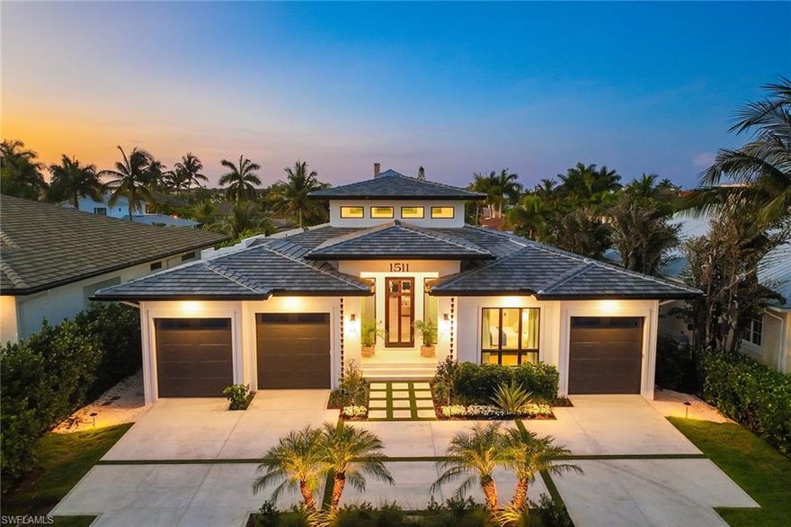 Welcome to your deep-water direct access waterfront dream home in the Royal Harbor area of Naples. With over 75 feet of new seawall, you have ample dockage for big boats. This custom-built waterfront masterpiece offers the epitome of luxury living with stunning architectural details, modern amenities and water views. Greeted by a contemporary facade that exudes elegance. The heart of this home is the spacious great room, which seamlessly integrates the living, dining and kitchen areas. The soaring ceilings adorned with exposed wooden beams create an airy, inviting atmosphere with an open floor plan ideal for intimate family gatherings and entertaining guests. Large windows and sliding glass doors provide tranquil views of the water and easy access to the outdoor spaces. The gourmet kitchen is a chef's delight, equipped with top-of-the-line Thermador stainless steel appliances, custom-designed cabinetry and a large island with seating. The adjacent dining area features a custom live-edge wood table, adding a touch of natural elegance to the space. The living area boasts comfortable seating arrangements, a cozy fireplace and stylish shiplap decor that complements the home's modern aesthetic. Retreat to the luxurious primary suite, which offers a private sanctuary with water views, a spacious connecting walk-in closet and a spa-like en-suite bath. Additional bedrooms are generously sized, each with its en-suite bath, providing comfort for family and guests. Step outside to the expansive patio and discover your private oasis, which includes a fully equipped outdoor kitchen and a pristine pool with a spa, all overlooking the serene water. This home also features a private 75-foot Trex dock with a platform lift and direct deep-water access to the Gulf of Mexico, making it a boater's paradise. Experience the best waterfront living in this exquisite new custom home that blends luxury, comfort and style in one of Naples' most sought-after communities, offering the convenience of being minutes from vibrant downtown Naples 5th Avenue.