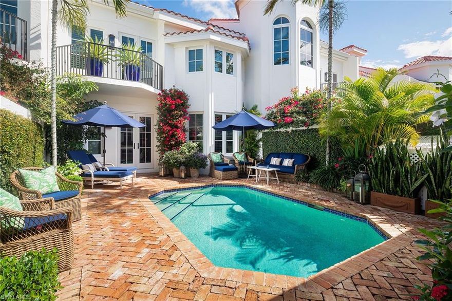 Located on a quiet street, in the heart of Olde Naples, this charming remodeled residence offers a private gated entry, with manicured gardens and spectacular southern exposure.  Chicago brick pavers lead to the expanded double-door entry, featuring Andersen impact-rated doors, walnut floors, and plantation shutters throughout.  The open-concept kitchen is highlighted with white cabinetry, top-of-the-line appliances, and a Shaw farmhouse sink surrounded by white Quartz countertops. Spacious primary suite offers vaulted ceilings, a light-filled marble bath, and French doors that lead out to a balcony overlooking the pool.  Unique poolside cabana gives flexibility for both owner and guests.  A 2-car garage off the alleyway completes the property.  **This property had NO water intrusion from Ian**. Pet policy is 1 pet up to 60 lbs or 2 pets up to 30 each.