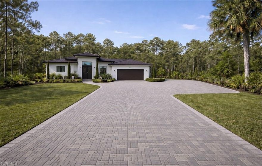 | Pool Not Started

An exceptional Under-Construction Luxury estate offering privacy and scale on 2.27 acres in Golden Gate Estates. Designed for discerning luxury buyers seeking modern elegance and long-term value, this residence blends refined architectural design with superior structural integrity.

Featuring soaring ceilings, a grand open-concept great room, and elevated finishes throughout, the home is built with impact-resistant windows and doors, solid concrete block construction, and a standing seam metal roof — delivering both sophistication and durability.

The gourmet kitchen is designed to impress with an oversized island and expansive walk-in pantry. The primary suite offers a spa-inspired retreat complete with dual vanities, soaking tub, glass-enclosed shower, and generous walk-in closets.

Plans include a resort-style pool; construction has not yet commenced. Estimated completion is approximately four months from start date. Buyers may have a limited opportunity to influence pool design and finish selections depending on timing.

An outstanding opportunity for cash buyers and international buyers seeking new construction luxury, privacy, and investment potential in one of Southwest Florida’s fastest-growing estate communities.

Images shown are artist renderings of the proposed construction. Actual home, finishes, features, and landscaping may differ upon completion.