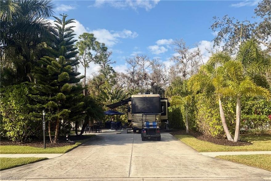 Off-lake motorcoach site located in Pelican Lake Motorcoach Resort.  This site is move-in ready or you can upgrade it to your likings.  Back-in to this private site near the East end of the resort with the preserve behind it.  Site includes a newer type of pedestal and lush tropical landscaping surrounding it for privacy.
Coach house Details: 
A 10x10 coachhouse is on the property and finished with a toilet, sink, and cabinets with countertop.  The exterior is finished with awnings on all sides and storage areas are on two sides of the coachhouse.