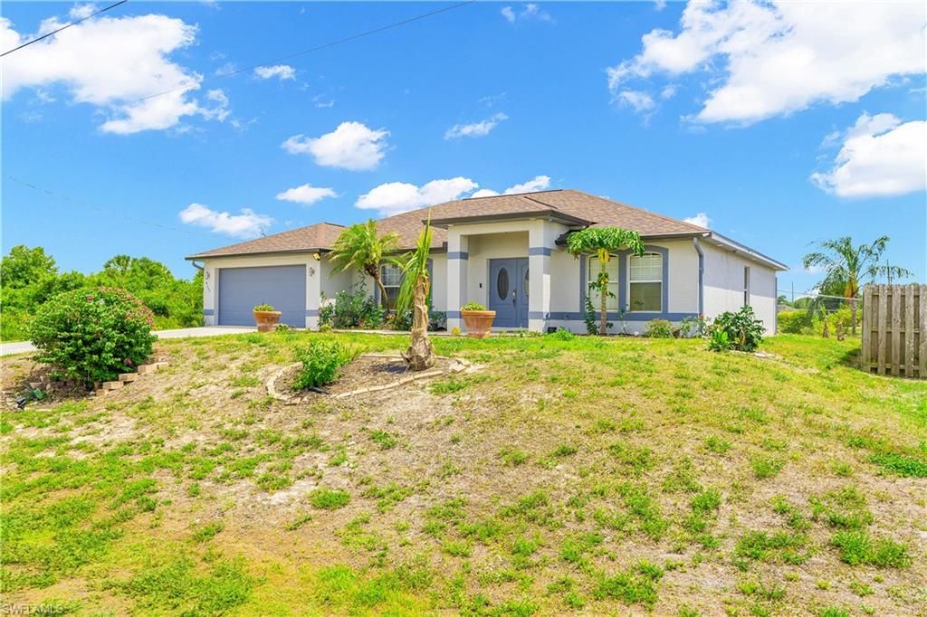 Photo of 4207 30th ST SW, LEHIGH ACRES, FL 33976 (MLS # 226019559)