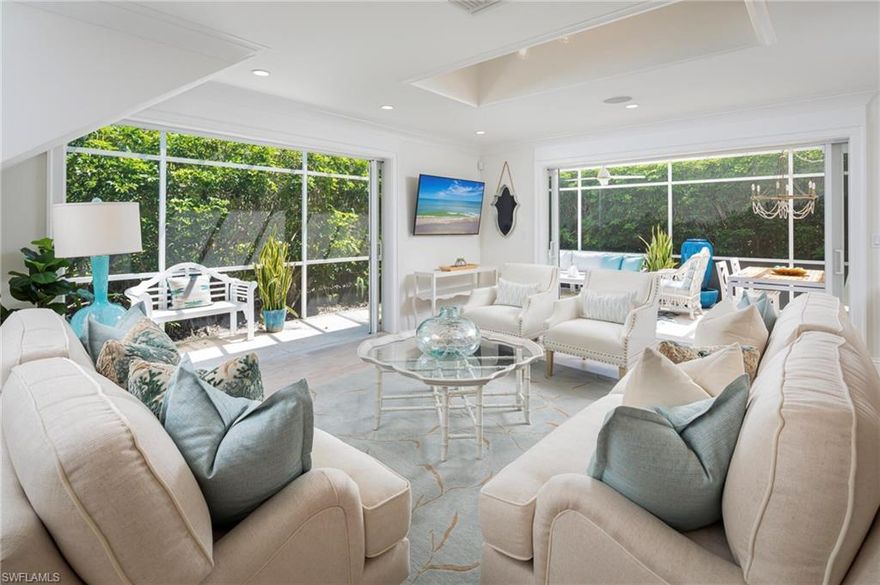 Rarely available free-standing villa in a prime downtown location, affording the ultimate in privacy and a true walk-around town lifestyle. A small enclave of just 17 residents enjoys two oversized pools and just two blocks to the beach. Meticulously renovated in 2018 and expanded with a redesigned floor plan, complete with impact windows and doors, all new mechanicals and exceptional outdoor space. Spectacular details throughout, including wood floors, detailed crown molding and pocketing sliders that open to multiple outdoor screened areas and a private garden. A true chef’s kitchen featuring a large center island with opal white quartzite countertops, oversized stainless steel sink with one-touch chrome faucet and a Bertazzoni induction range. A separate built-in bar sits just off the dining area and is a perfect place for crafting afternoon cocktails. Light-filled primary suite boasts detailed vaulted ceilings, three custom closets, dual sinks and a separate makeup area. The unique cupola design allows for countless hours of sunshine to filter throughout all spaces, a wonderful reminder that you are in Naples.  Exterior renovations are starting this summer.